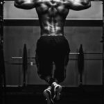 grayscale photo of man working out