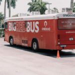 red and white coca cola bus on road during daytime